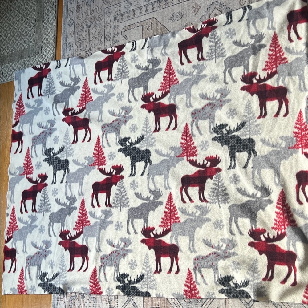 Fleece material with reindeer theme.